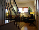 Stairs, wrought iron railing, living room